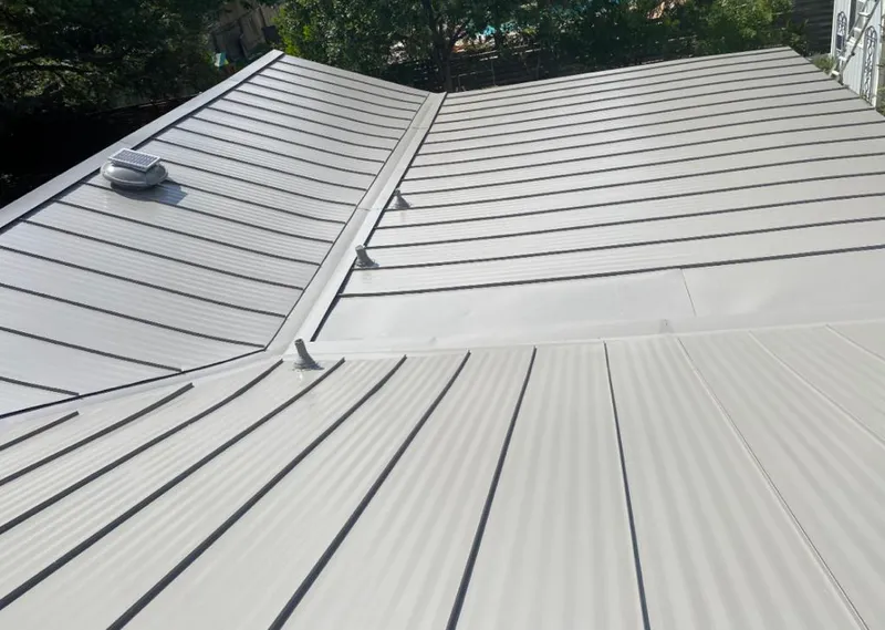 Solar attic fan installed on a metal roof for Roof Ventilation in Mountain Home